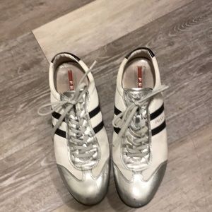 Prada running shoe with Adidas stripe and silver lame details